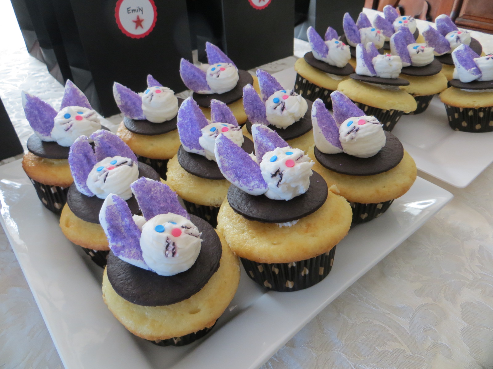 Birthday party cupcakes with marshmallow rabbits on top.