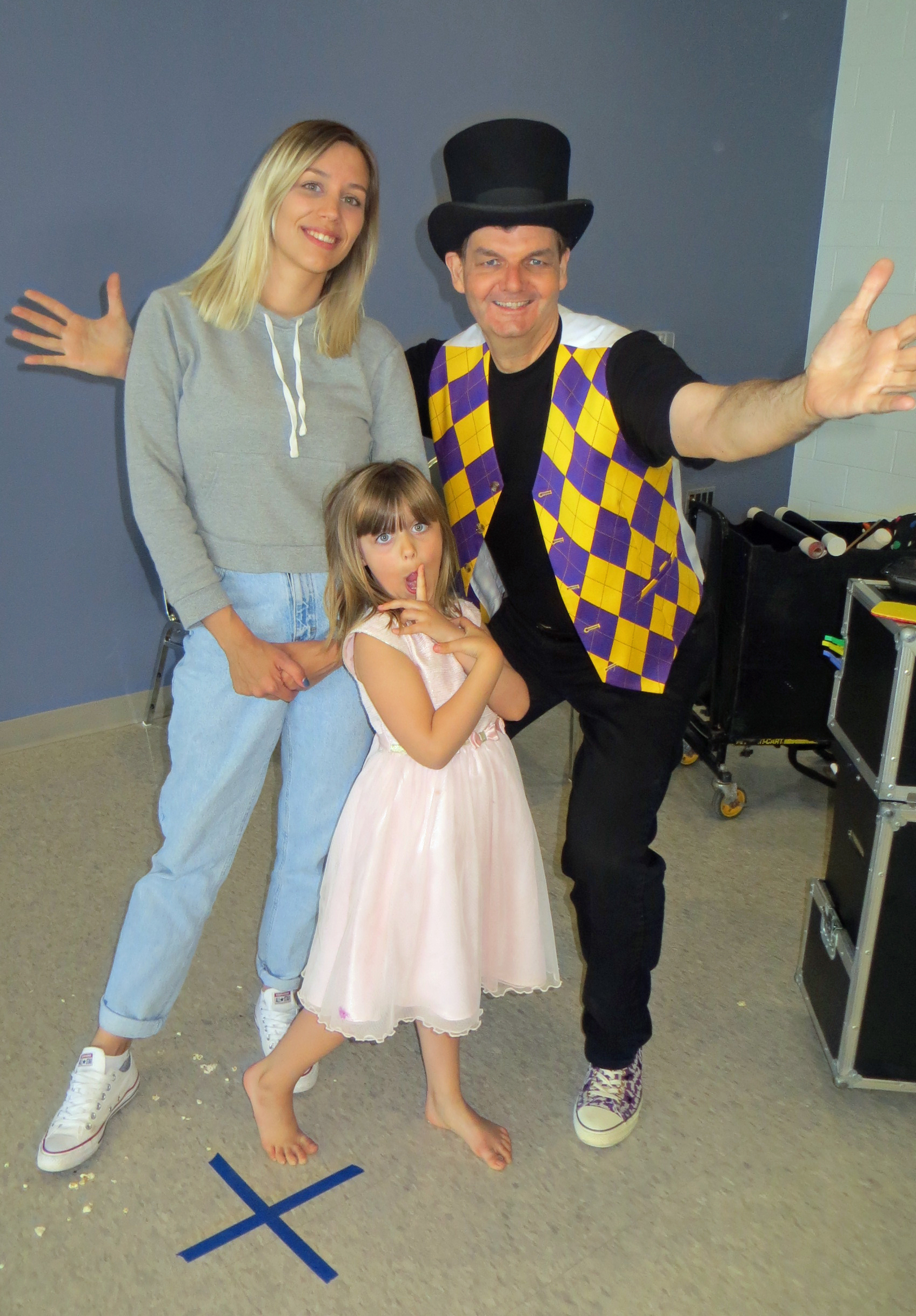 Magician Owen with birthday girl and her mom.