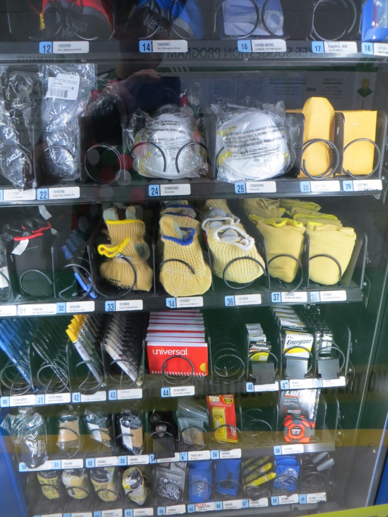 Vending machine filled with factory worker needs instead of food or drink.