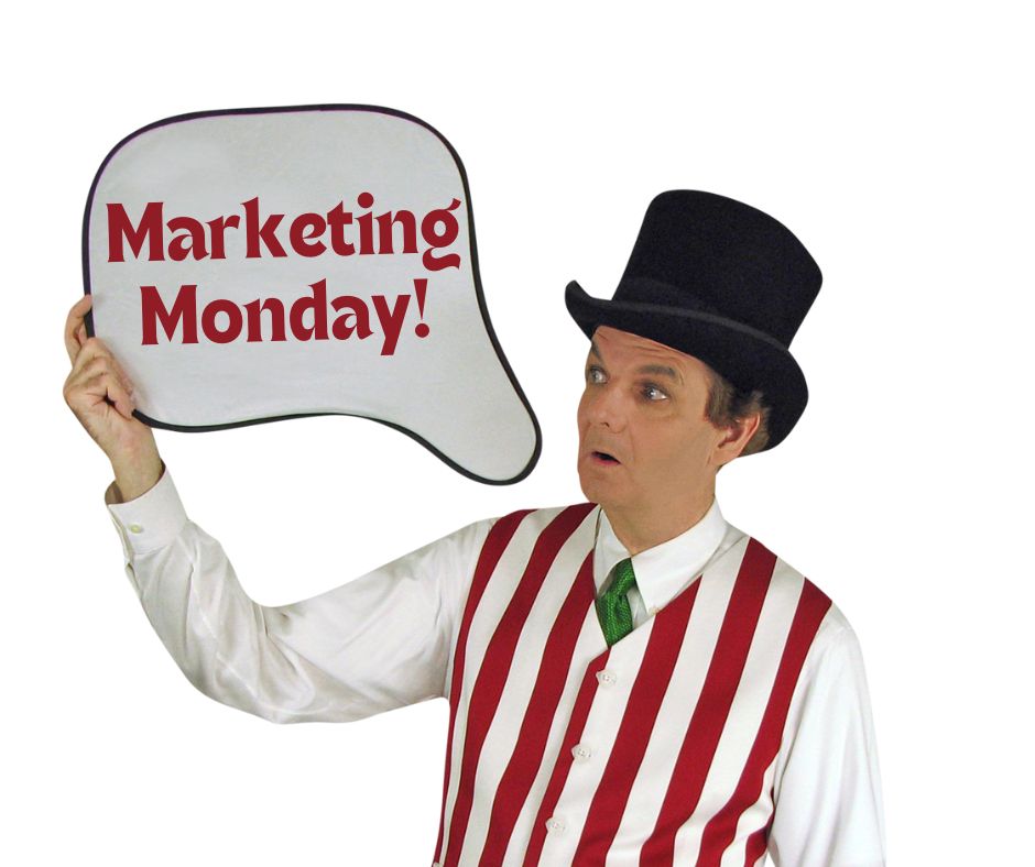 Magician Owen looking at a thought bubble which reads Marketing Monday.