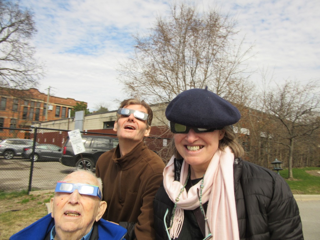 Me with a friend and her elderly father all wearing our eclipse glasses.