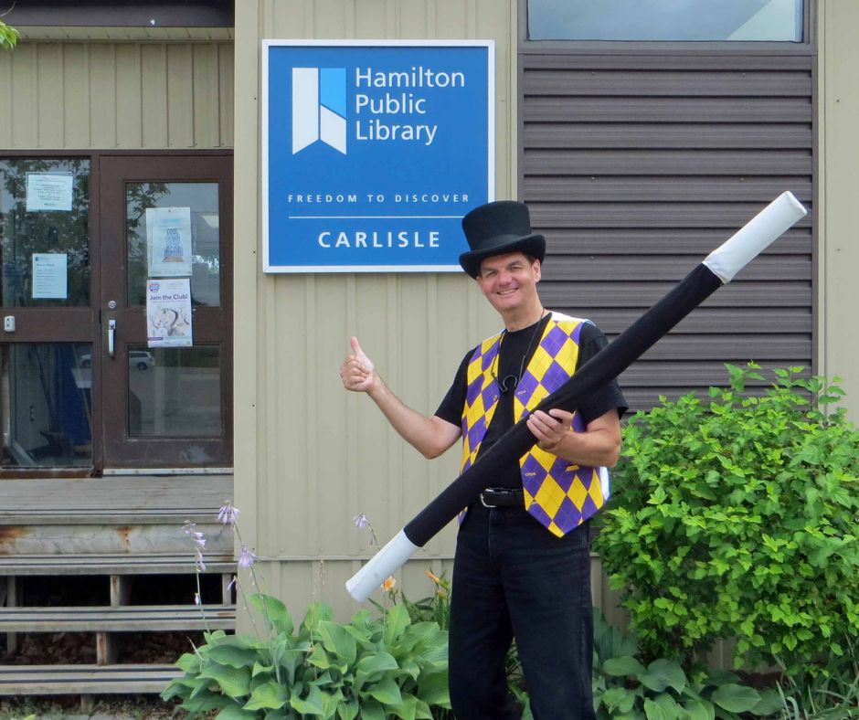 Magician Owen in front of old location Carlisle branch library.