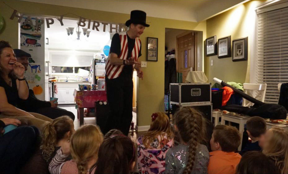 Magician Owen performing at a typical childrens birthday party.
