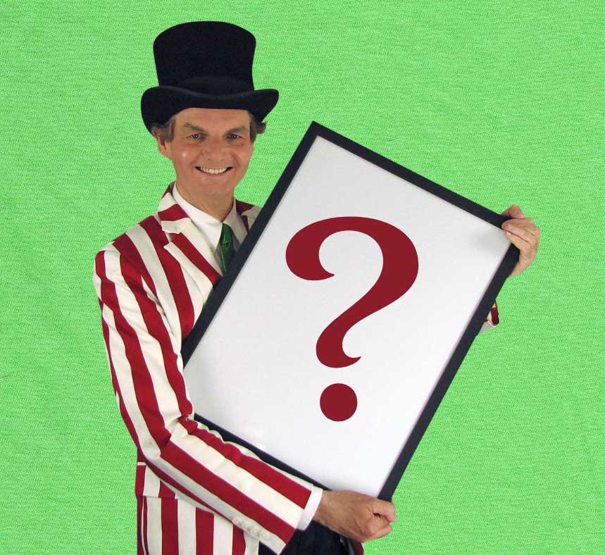 Owen holding a whiteboard with a large question mark on it.