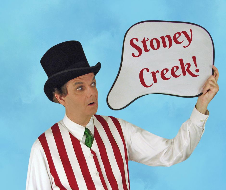 Magician Owen looking at a thought bubble which reads Stoney Creek.